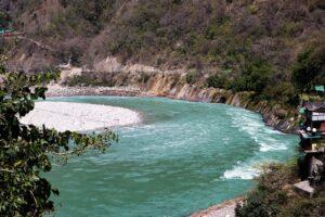A river flows through a mountainous landscape.