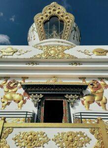 Exploring the stunning details of a Buddhist stupa in Budhanilkantha, Nepal, with intricate golden designs.