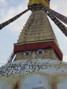 Stunning view of Boudhanath Stupa adorned with vibrant prayer flags in Kathmandu.